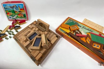 two wooden toys that are sitting on a table
