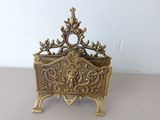 a small brass box that is sitting on a table