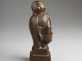 an image of a bronze statue of a woman with a hat on her head