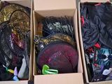 two boxes with different types of purses inside of them