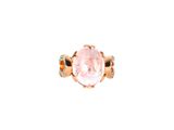 a close up of a ring with a pink stone on it