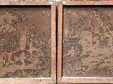 two wooden frames with a pattern on them on the wall