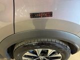 a close up of a car ' s tire with a sticker on it