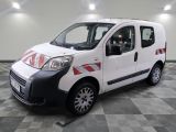 a picture of a small white van parked in a garage