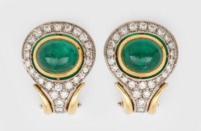 a pair of emerald and diamond earrings
