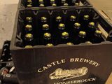 bottles of beer are stacked on top of each other in a box