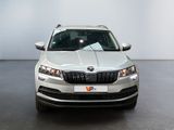 the front view of a white skodar parked in a room