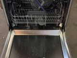 an image of a dishwasher with a lot of dishes inside of it