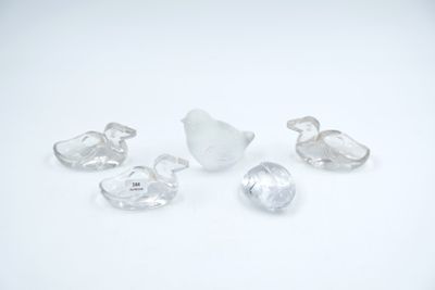 several pieces of clear glass sitting next to each other on a white surface