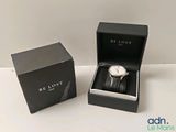 an image of a watch in a black box on a white surface