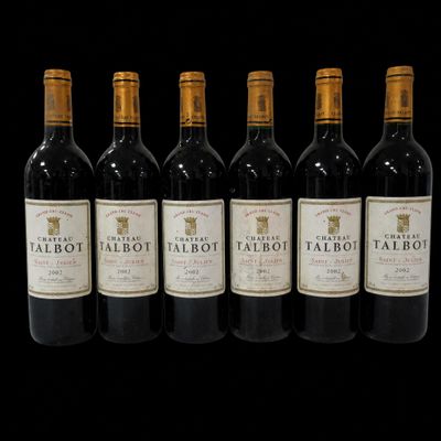 six bottles of red wine are lined up in a row