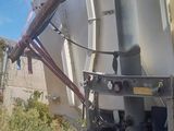 a dump truck that is parked on the side of the road