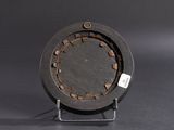 an image of a black clock on a metal stand