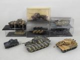 many different types of toy tanks in a display case
