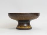 an image of a brown and black bowl on a white surface