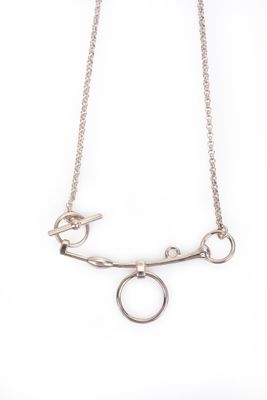 a close up of a necklace on a white background