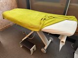 a massage table with a towel on top of it