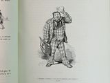 an open book with a drawing of a man in a suit and tie
