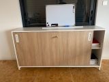 a tv that is sitting on top of a cabinet