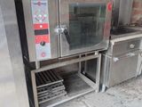 two ovens sitting next to each other on a sidewalk