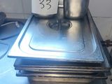 three pans sitting on top of a stove in a kitchen