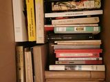 a box full of books sitting on the floor