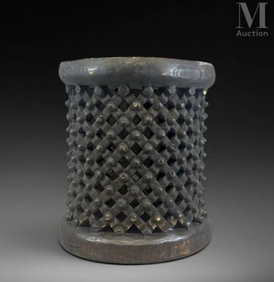 a close up of a metal object with a black background
