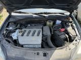 the engine of a car with its hood open and the hood open