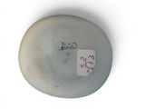 a white plate with a sticker on it