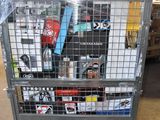 a metal cart with many items in it in a warehouse