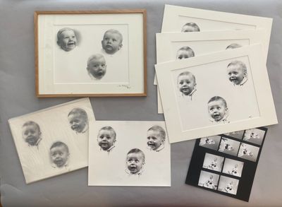 several black and white photographs of babies are on a table