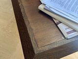 a wooden table with a bunch of books on it