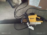 a chainsaw that is sitting on the ground