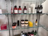 many different types of skin care products displayed on the shelves