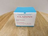 a box of clarins sitting on a wooden table