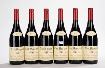 six bottles of red wine are lined up in a row