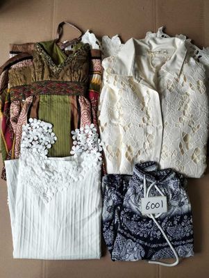 four different types of clothing laid out on the floor