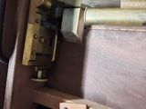 a close up of a door handle on a wooden door