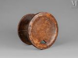 an old wooden barrel with a hole in the middle