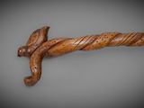 an image of a wooden sword on a gray background