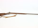an old rifle on a white background with a wooden handle