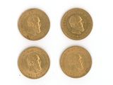 three gold sovereigns, one of which has a head and two of which have a crown on it