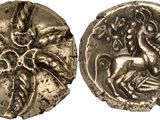 une pièce d'argent sur laquelle figurent un cheval et un homme