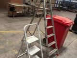 a ladder and a trash can in a warehouse
