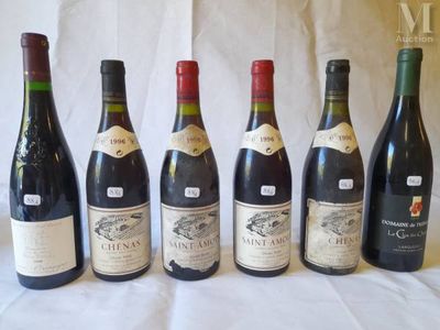 six bottles of wine are lined up in a row on a table