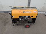 a small generator that is on the ground in front of a building