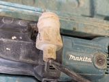 a blue machine with a cord attached to it ' s side