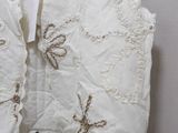 a picture of a white dress on a hanger on a wall