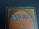 the back of a box of magic the gathering cards on a table