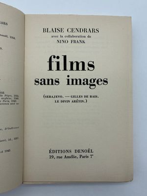 un livre ouvert posé sur une table blanche, avec une image en noir et blanc